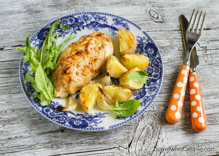 a plate with garlic chicken on a table