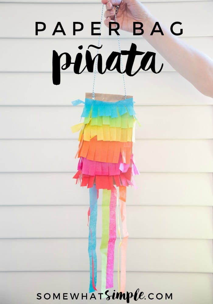 Kick your party up a notch on the "fun meter" with these simple paper bag piñatas! Made with just a few simple supplies, these are so much fun to make and even more fun to break open! #kidscraft #paperbagpinatas #papgerbagpinatasforkids #cincodemayo #craft #fiesta #easycraft via @somewhatsimple