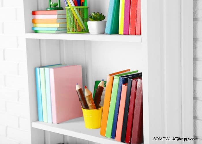 organized bookshelf with colorful books and decor