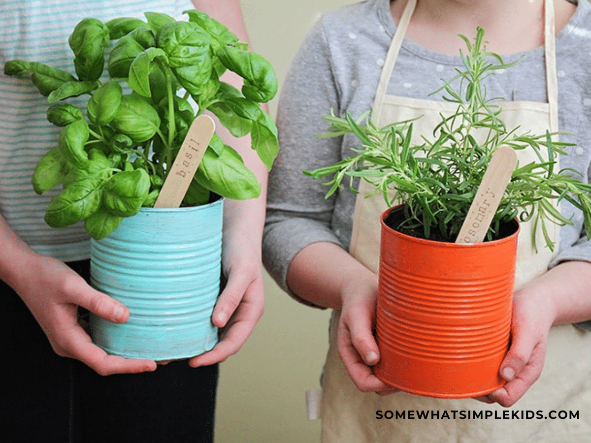 two children holding a can of herbs