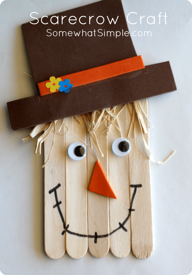 Grab a few simple supplies and get ready to create a darling little scarecrow! This simple scarecrow craft is the perfect art project to do with your kids this fall! Made with popsicle sticks and a few other basic supplies, this activity is perfect for kids of all ages. #fall #craft #kidscraft #halloween #scarecrow #scarecrowcraft via @somewhatsimple