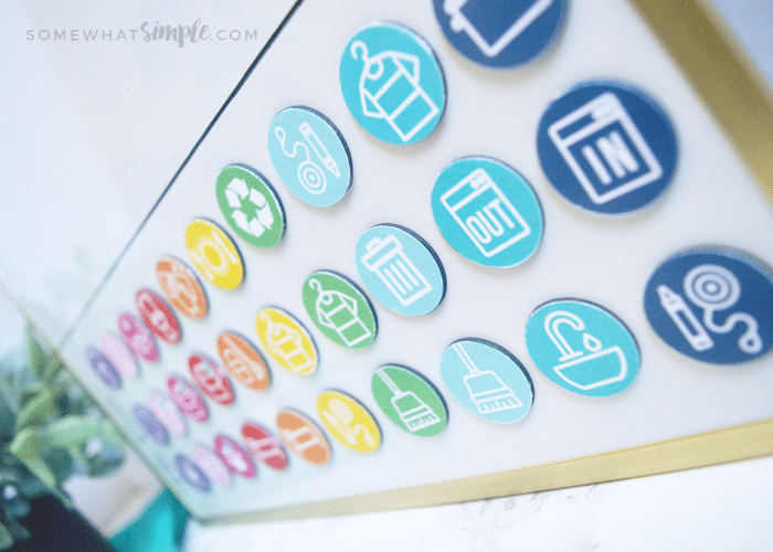 a close up of brightly colored magnets that are being used for kids' chores