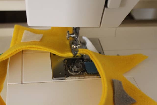 final stages of making a crown by sewing the ends of the crown together