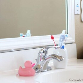frame your bathroom mirror over plastic clips