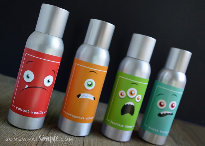 line of 4 air fresheners showing cute monster spray