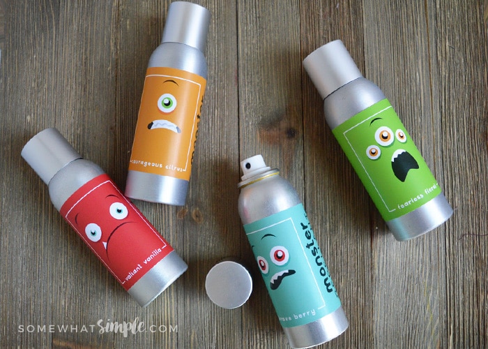 4 monster sprays laying on their side