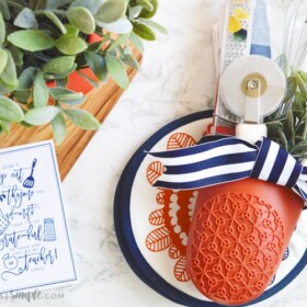 end of the year teacher gift with kitchen gadgets stuffed inside an oven mitt