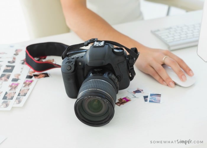 Digital camera on photographers desk in creative office