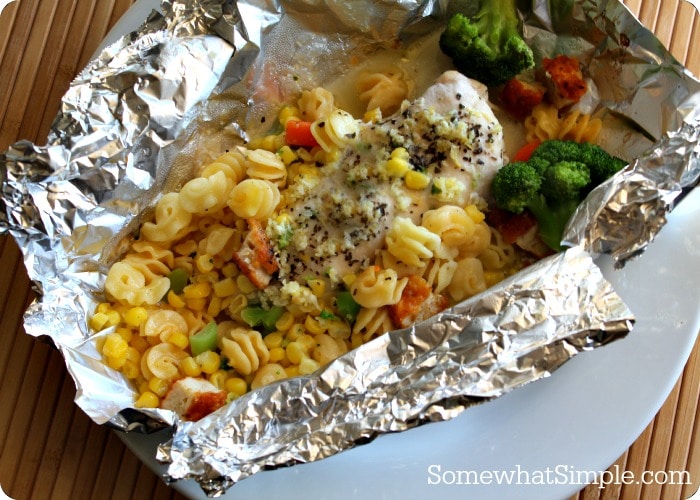 a foil packet dinner with chicken and pasta