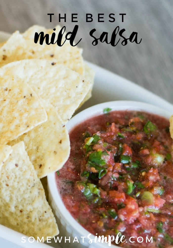 The perfect blend of fresh veggies and savory spices - this mild salsa is easy to make and tastes amazing! #mildsalsarecipeforcanning #mildsalsarecipewithfreshtomatoes #mildsalsarecipeeasy #mildsalsa #freshsalsarecipe via @somewhatsimple