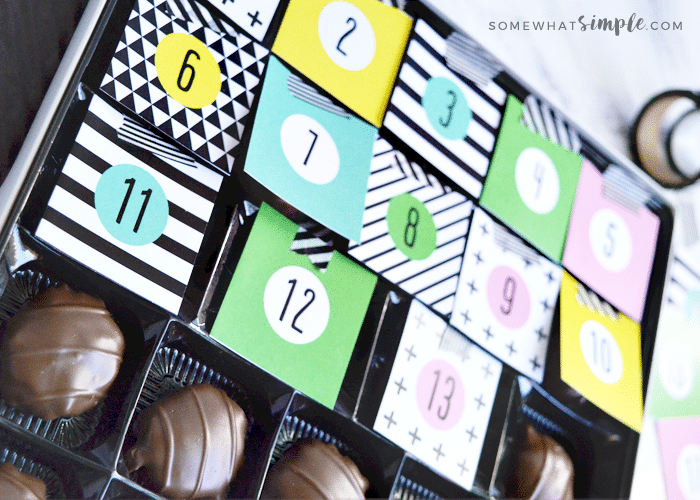 DIY chocolate christmas calendar with tags 1 through 13 covering the chocolates