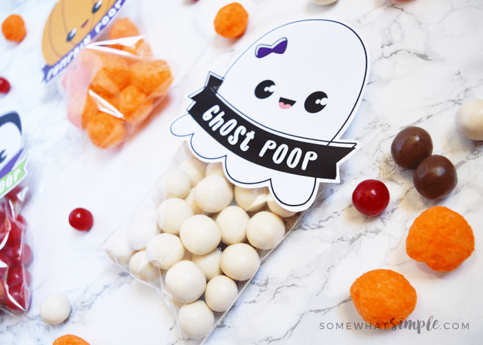 a ghost poop treat bag with white candies inside