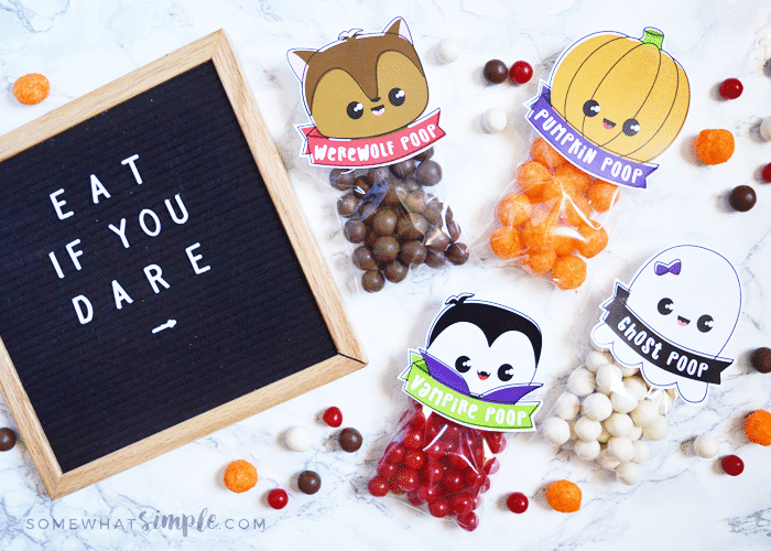 halloween treat bags with warewolf, vampire, ghost and pumpkin poop toppers