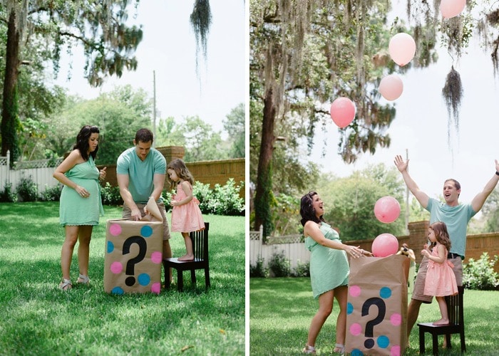 a man, womand and little girl opening a box with a question mark on the side with pink balloons floating out of it is a simple gender reveal idea