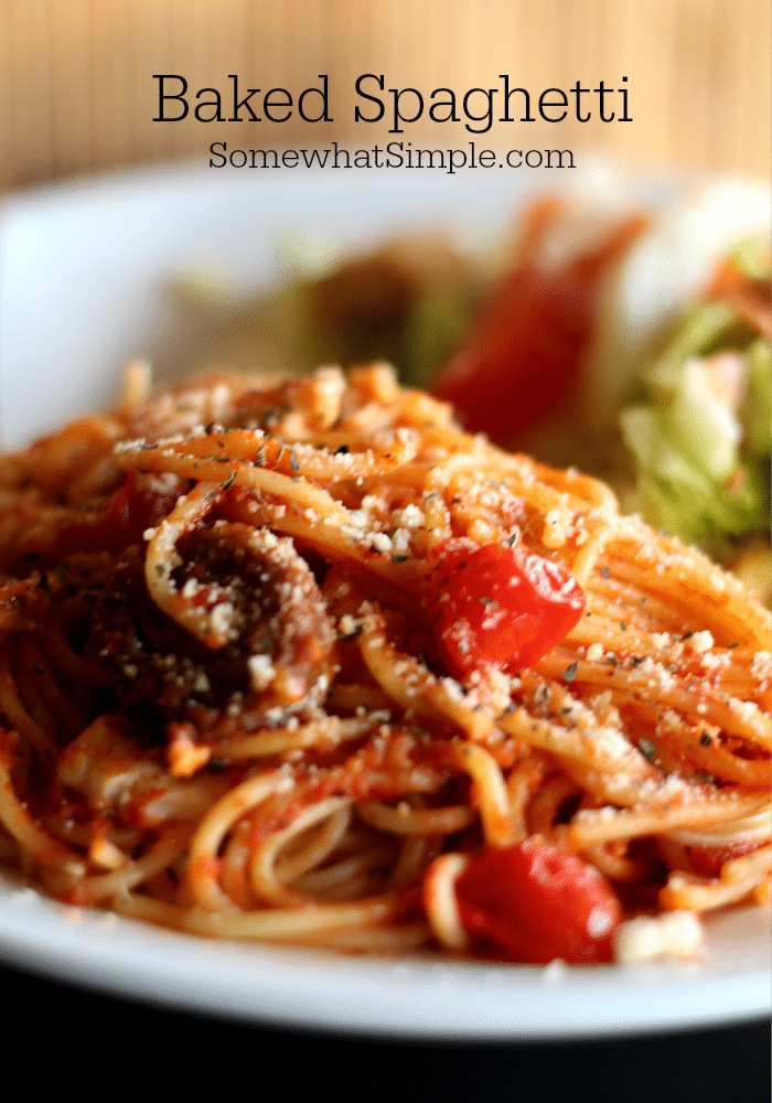 Baked Spaghetti is a tasty twist on a classic meal! A quick and savory meat sauce combined with spaghetti and topped with delicious cheese, then baked in the oven until hot and bubbly! The perfect week-night dinner for family gatherings or potlucks. #spaghetti #spaghettisauce #bakedspaghetti #italianfood #casserole #pasta via @somewhatsimple