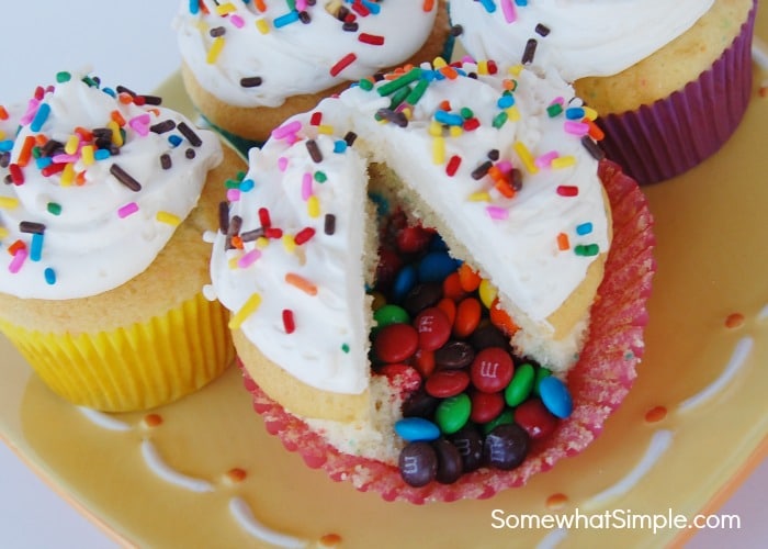 a plate of Pinata Cupcakes