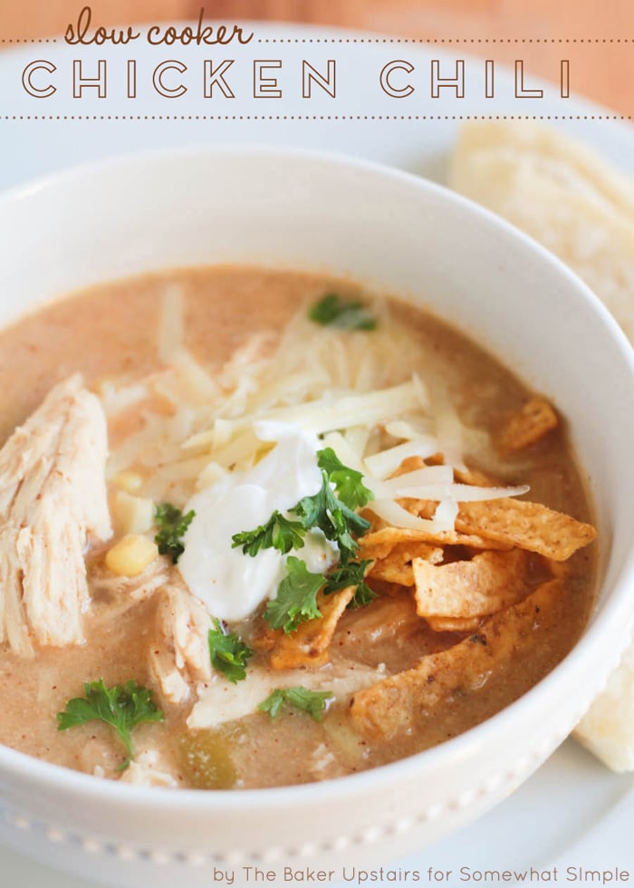 This slow cooker white chicken chili recipe is the perfect dinner on a chilly day.  Filled with tender chicken, white beans, vegetables and cream cheese, it doesn't get any better than this comfort food! via @somewhatsimple