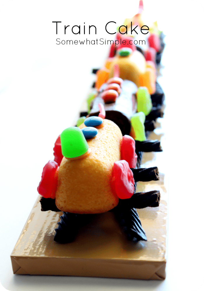 This train cake is super easy to assemble and perfect for the Thomas train fan in your family. via @somewhatsimple