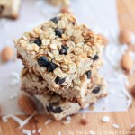 squares of a blueberry granola bar stacked on top of each other