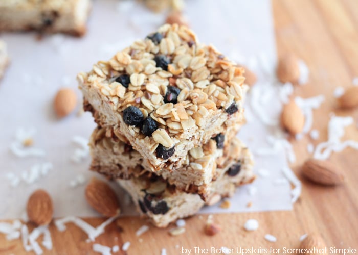 squares of a blueberry granola bar stacked on top of each other