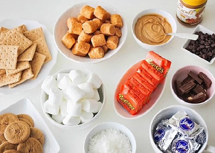 white bowls filled with smores makings is a delicious dessert idea for a bbq