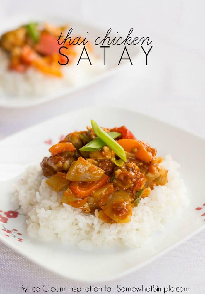 Freshly chopped veggies and tender chicken covered in a delicious sauce and served on a fluffy bed of rice - this Thai Chicken Satay recipe is made in just minutes and tastes totally amazing!! via @somewhatsimple