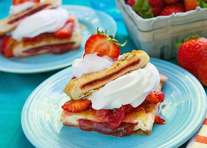 a blue plate with Strawberry Shortcake piled high is an easy dessert to make when camping