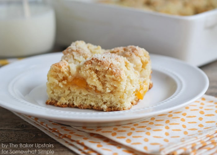 a piece of Peach Streusel Coffee Cake on a white plate