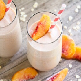 two glasses of a healthy peach smoothie