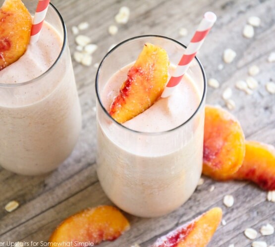 two glasses of a healthy peach smoothie