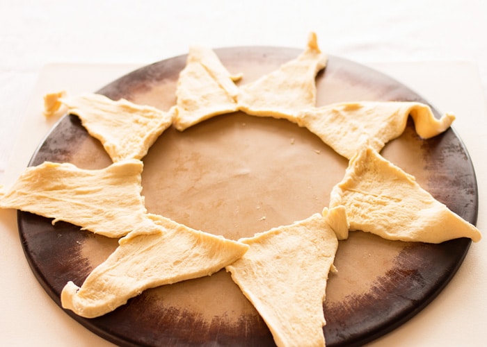 croissant dough layed out in a circle