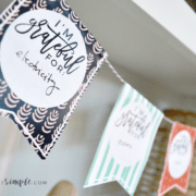 a gratitude garland thanksgiving craft hanging on a shelf