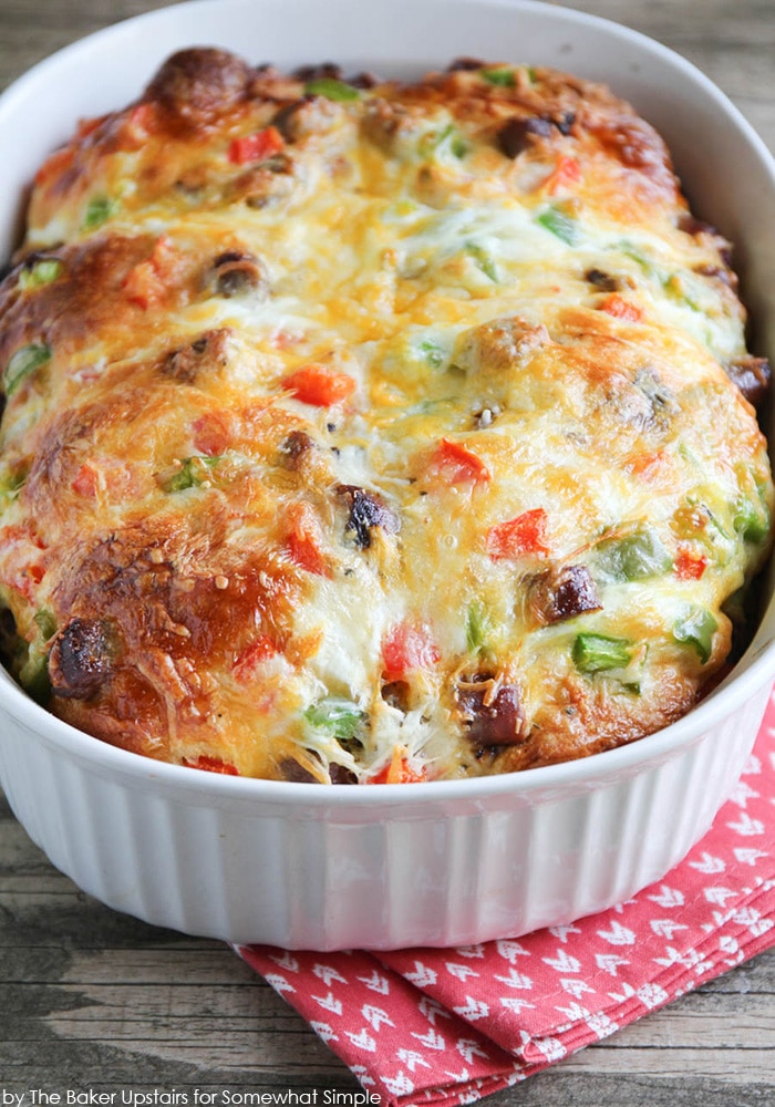 a casserole dish filled with cooked Sausage and Pepper Breakfast Biscuit Casserole