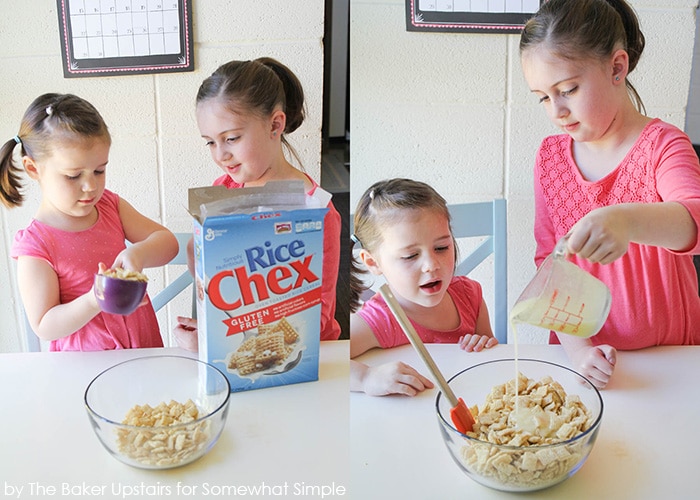 two girls making a chex mix