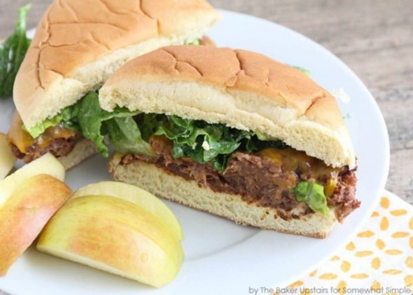 a black bean burger on a plate cut in half