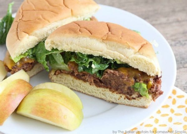 a black bean burger on a plate cut in half