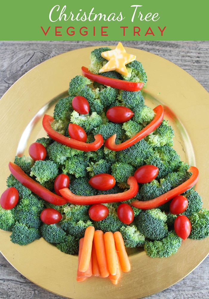 This Christmas tree veggie tray is simple and easy to make. The kids will love helping you arrange the veggies on the tray to make a fun Christmas tree shape that's perfect for the holidays. This veggie tray idea is simple and festive and makes the perfect holiday appetizer. via @somewhatsimple