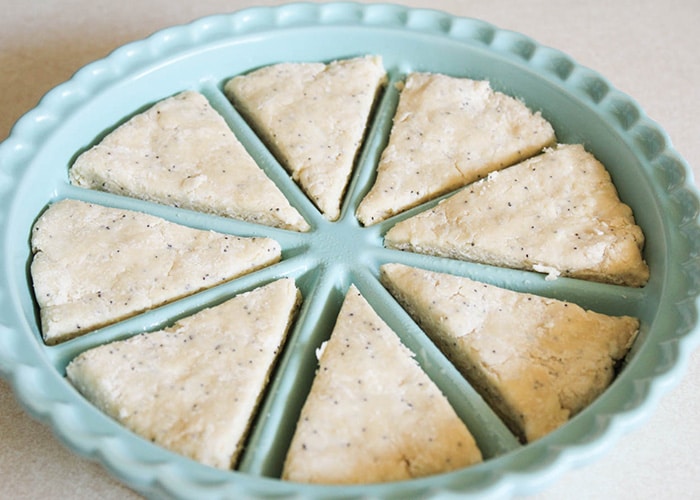 dough separated into a scone pan