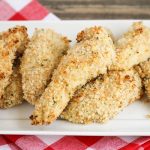 a serving dish filled with homemade Crispy Chicken Fingers