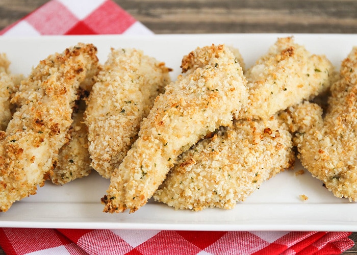 a serving dish filled with homemade Crispy Chicken Fingers