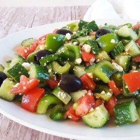 This Greek Salad recipe is full of hearty and bold flavors, but it's a cinch to pull together. Serve it as a side dish or even as a light dinner!