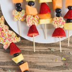 easter snacks - Rice Krispies cut out for easter with sprinkles and fresh fruit on a stick