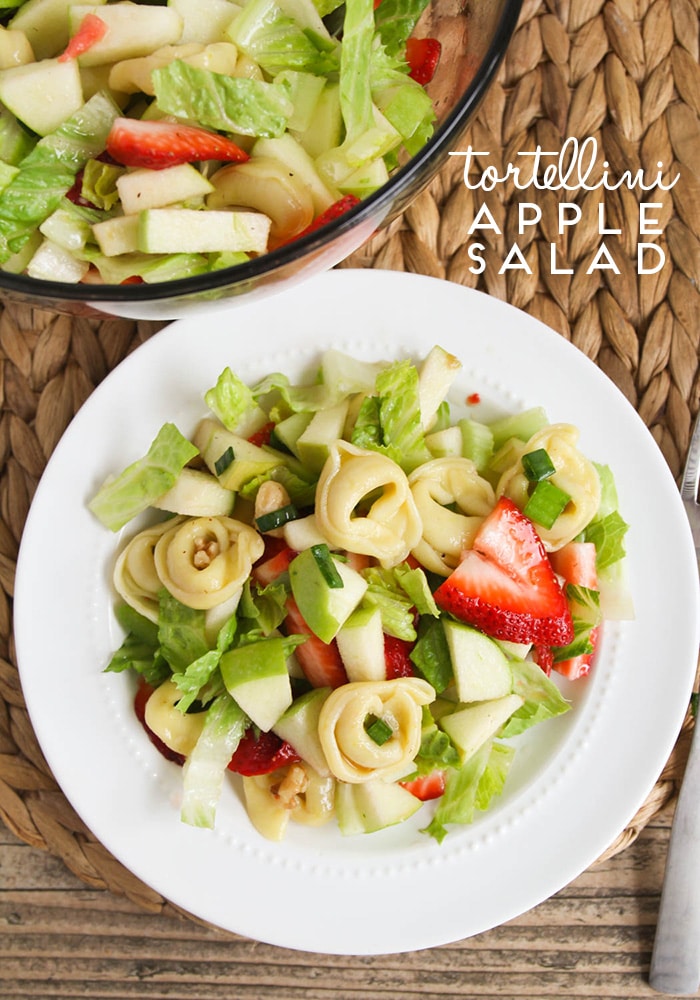 This tortellini apple salad is one of my favorite salads to make during the warm summer months! It is filling and fresh and very delicious! Made with fresh apples and strawberries and topped with a delicious homemade dressing, this salad recipe is amazing! #tortellinisalad #appletortellinisalad #summersaladrecipe #summertortellinisalad #tortellinisaladrecipe via @somewhatsimple