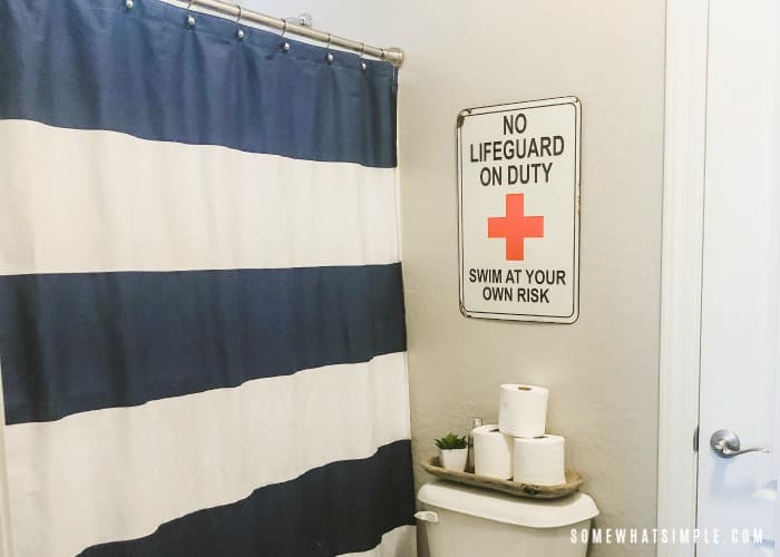 Boys Bathroom with navy and white striped shower curtain