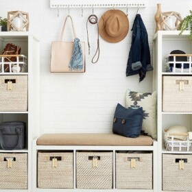 various wooden shelves with bins inside each compartment for storage