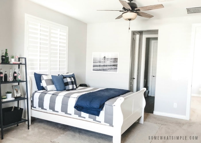 bright and fresh teen boys bedroom with gray and white and navy decor