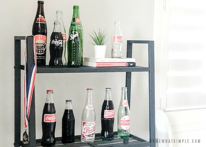 teen boys bedroom shelf with vintage soda bottles lined up