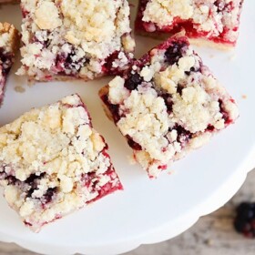 a cookie stand filled with Blackberry Crumble Bars