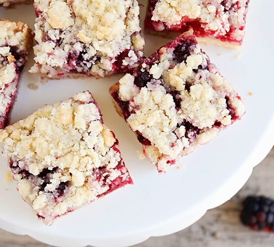 a cookie stand filled with Blackberry Crumble Bars