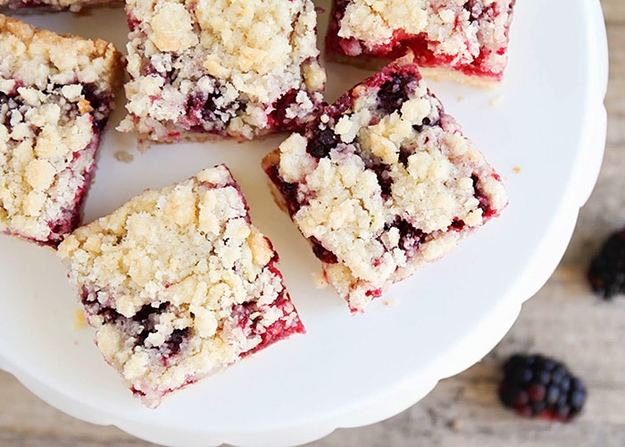 a cookie stand filled with Blackberry Crumble Bars